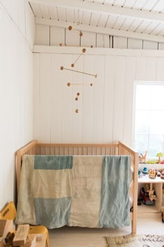 a baby's room with a crib and toys