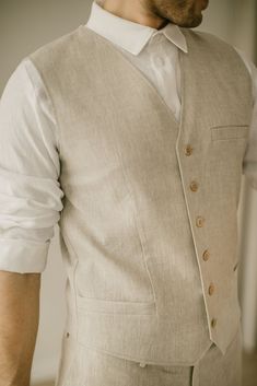 "Each linen waistcoat is handcrafted to fit individual body measurements. We take pride in the fact that there are no factory processes involved in making our linen clothes. Each linen vest is made with care and attention to detail. DESCRIPTION. This linen waistcoat is a modern yet ethno-inspired and exceptional gift, who will enhance the personal style of man with its timeless charm. The vest is made from two linen layers, so it will keep its form and still allow your skin to breathe easily. It Mens Elopement Vest, Luxury Cotton Men's Vest, Boho Wedding Mens Vest, Groom Vest Vintage, Wedding Vest Groom, Linen Outfit For Men Wedding Attire, Linen Waistcoat Men, Linen Formal Dress, Linen Clothes For Men