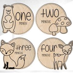 four wooden coasters with different animals and words on the front, one for each