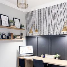 an office with two desks and shelves on the wall