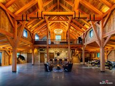 the inside of a large wooden building with high ceilings