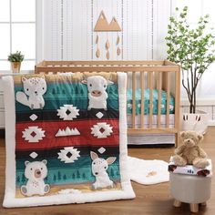 a baby crib with a teddy bear next to it and a blanket on the bed