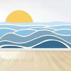 an empty room with wood flooring and a wall mural depicting the sun rising over the ocean