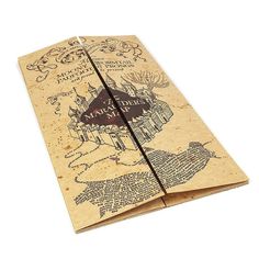 an open book with harry potter's map printed on it, sitting on a white surface