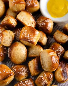 bread rolls with sesame seeds and butter on top