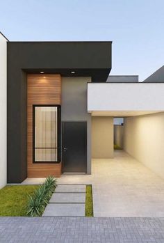 a modern house with an entry way leading to the front door