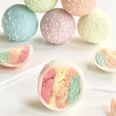 there are some cake pops with different colors on them