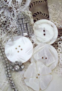 some buttons and lace on a table