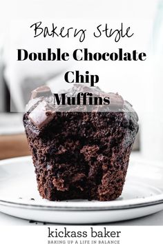 a chocolate cupcake on a white plate with the words baking style double chocolate chip muffins