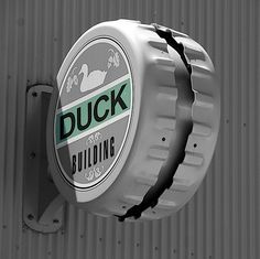 an image of a duck sign on the side of a building in black and white