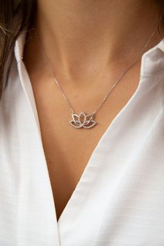 Minimalist design meets the charm of zen living in our delicate lotus charm necklace. Evoke feelings of growth and transformation with our golden lotus necklace, symbolizing the journey towards enlightenment.  Discover the serenity of the zen lifestyle with our Serene Zen necklace, a handmade silver lotus pendant. For yoga enthusiasts and those who appreciate spiritual practices, our Yoga Lover's Gift is a unique spiritual accessory.  Adorn your neck with the symbol of enlightenment through our Elegant Silver Charm Necklace For Meditation, Silver Elegant Charm Necklace For Meditation, Lotus Flower Jewelry, Zen Living, Zen Lifestyle, Zen Jewelry, Yoga Pendant, Golden Lotus, Yoga Lover Gift