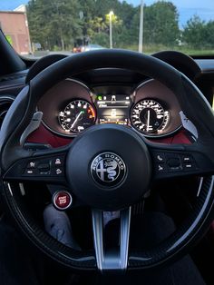 the interior of a car with gauges and steering wheel