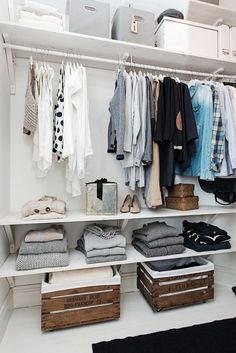 an organized closet with clothes and shoes