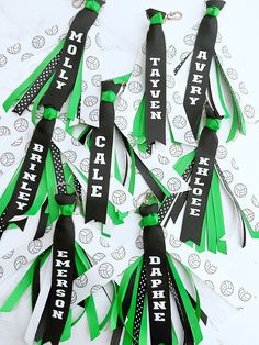 green and black ribbons with words on them