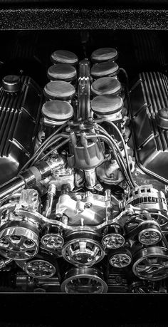 the engine compartment of a car with many different types of engines on it's side