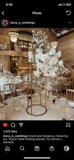 an image of a table setting with white flowers and candles on the centerpieces