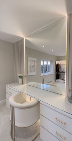 a large mirror sitting on top of a white counter