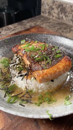 a plate that has some kind of food on it with rice and herbs in it