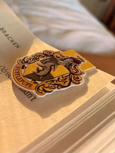 the hogwarts crest is on top of some books