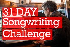 a man sitting in front of a computer with the words 31 day song writing challenge