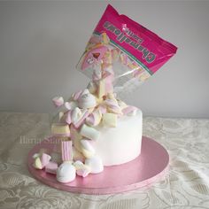 a cake with marshmallows and candy on top