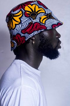 This unisex bucket hat features a fun, vibrant pattern that is also reversible, making it a versatile and stylish accessory. The one size fits most design ensures a secure and comfortable fit for both men and women. Handmade in Ghana Size: 24 inches in diameterPrint: Kissie and Odo Colour Gel Photography, Mens Twists Hairstyles, Afro Goth, Afro Punk Fashion, Bucket Hat Pattern, African Hats, Museum Gift Shop, African Crafts, Reversible Bucket Hat