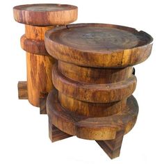 three wooden stools stacked on top of each other in the shape of an object