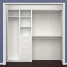 an empty white closet with drawers and shelves