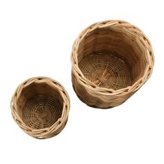 two woven baskets sitting next to each other