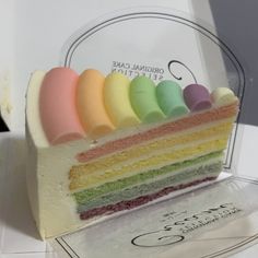 there is a piece of cake with different colors on it