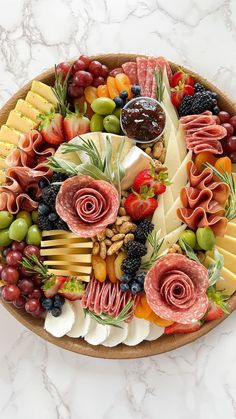 a box filled with lots of different types of fruits and veggies on top of a wooden table