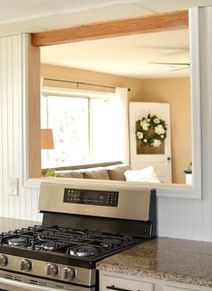 a stove top oven sitting inside of a kitchen