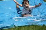 a young child is playing in the water