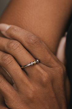 This chic fidget ring, known as Lillian, boasts a sleek gold/silver design and is both waterproof and tarnish resistant. Keep your hands busy and your style on point with this elegant accessory. MATERIAL: 18k PVD Gold Plated, Stainless Steel SIZES: 6, 7, 8 Water resistant, tarnish resistant, hypoallergenic, & nickel/lead free. Mixed Metal Jewelry, Fidget Rings, Circle Ring, Silver Design, Hand Chain, Pinky Ring, Elegant Accessories, Bar Accessories, Mixed Metals