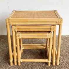 three bamboo nesting tables on carpeted area