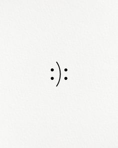 a black and white photo of an emoticive smiley face with dots on it