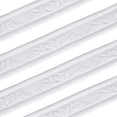 four white decorative moulders are lined up against a white background, each with an intricately carved design