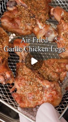 an air fried garlic chicken legs cooking on a grill with the words, air fried garlic chicken legs