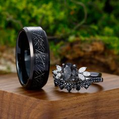 His Ring Details: Metal Type: Tungsten- silver foil imitated meteorites Band Width: 8 mm Her Ring  Details:  Enagagement ring: Metal Type: 925 sterling sliver Center Stone: Black Rutilated Quartz Center Carat Weight: Oval cut 1.09ct (6x8mm) Side Stone: moissanite Side Carat Weight: marquise cut 0.42ctw Band Width: 1.8mm Wedding band:  Metal Type: 925 sterling sliver Side Stone: Natural Black Spinel Band Width: 1.8mm SKU: CNWGJZ08995B105+ AMXR0016 Accessories: *Shipped with beautiful ring box; Couples Rings Matching, Black Band Wedding Rings For Her, Nature Inspired Wedding Ring Sets, Black Couple Rings, Black Wedding Rings Sets Couple, Goth Wedding Rings, Dark Wedding Rings, Black Wedding Ring Sets, Matching Ring Set