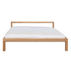 the bed frame is made from wood and has white sheets on it, while the headboard