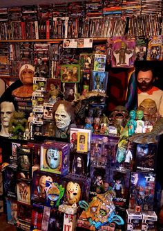 there are many toys on display in the store, including masks and other collectibles