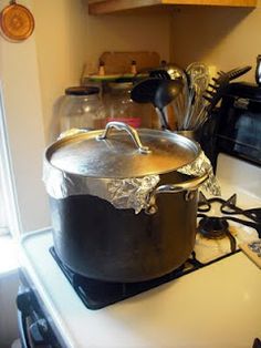 a large pot sitting on top of a stove next to an oven and toaster