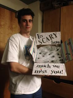 a man holding up a box that says it's my mom returns to send normal care packages to my dorm