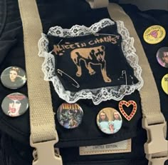 a back pack with buttons and badges attached to it