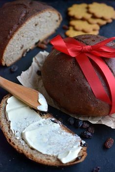 a loaf of bread sitting on top of a table next to crackers and cookies