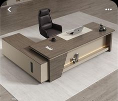 an office desk with a chair and laptop on it in the middle of a room