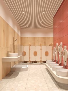 a bathroom with multiple sinks and urinals on the wall next to each other