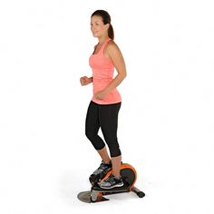 a woman is standing on an exercise board