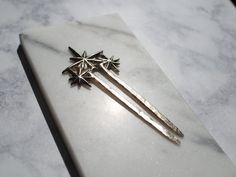 Wear an array of stars in your hair with the Constellation Hair Pin. This hair accessory adds a little sparkle to your look with a few stars clustered together!Effortlessly step up your bun with a hair stick and instantly look more polished and put together. A hair pin is the perfect way to create a beautiful hairstyle with minimal effort/time. Sturdy and well made, these pins are solid cast brass and will last a lifetime, heirloom quality. The finish has an organic look with little imperfection Star Wars Hair, Celestial Hair, Interesting Jewelry, Beautiful Hairstyle, Half Updo, Hair Stick, Granola Girl, Hair Sticks, Hair Pin