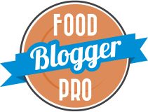 the food blogger pro logo is shown in blue and orange with a ribbon around it